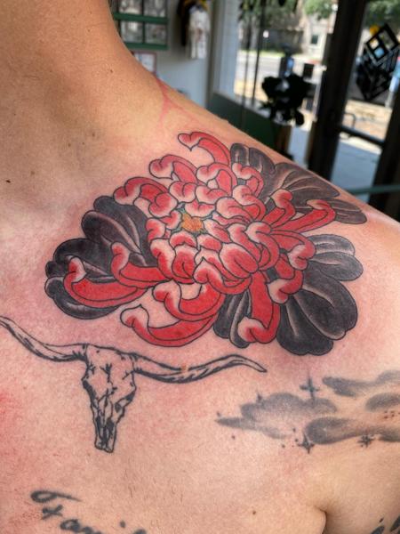 Traditional chrysanthemum tattoo by @andrewkingtattoo