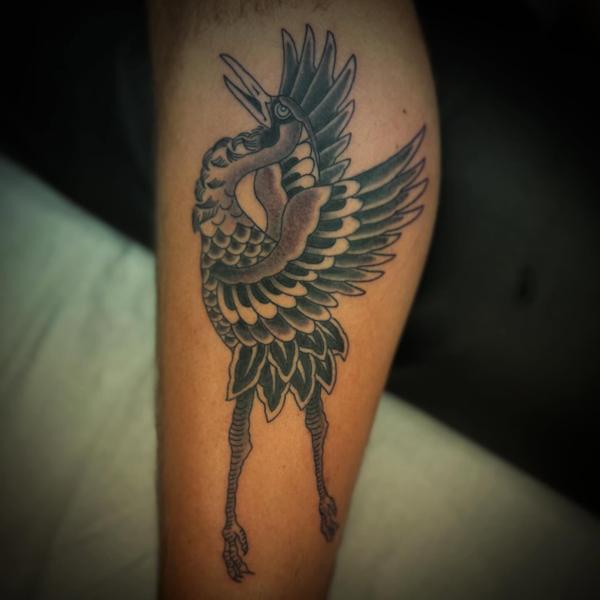 Traditional crane tattoo by @andrewkingtattoo