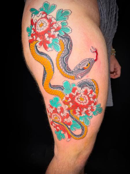 Japanese snake and flowers tattoo by @andrewkingtattoo