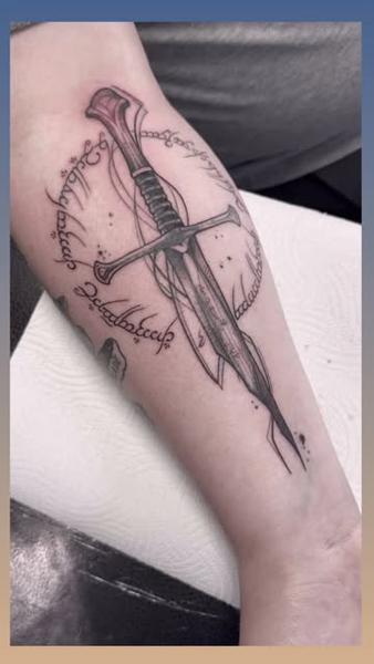 Blackwork elvish sword tattoo by @angelaltilar_tattoo
