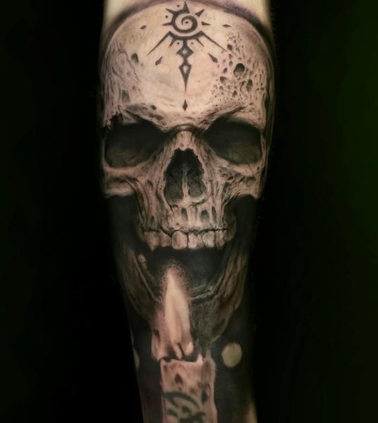 Realism skull candle tattoo by @angelaltilar_tattoo