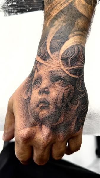Realism angel face tattoo by @angelstat2