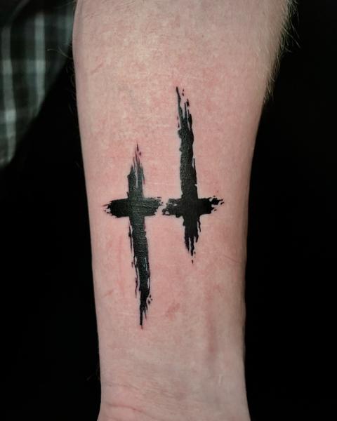 Blackwork brushstroke crosses tattoo by @angie_needs_ink
