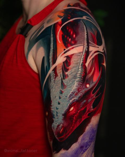Realism dragon tattoo by @animal_tattooer