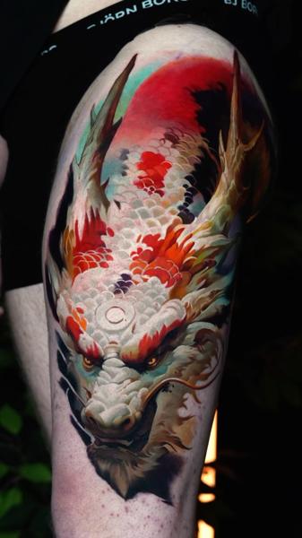 Realism dragon head tattoo by @animal_tattooer