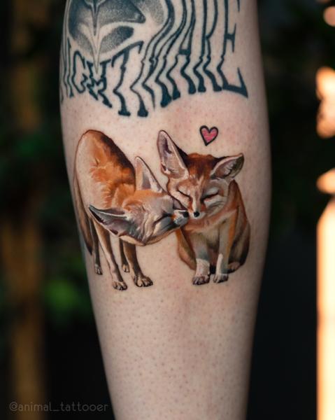Realism foxes with heart tattoo by @animal_tattooer