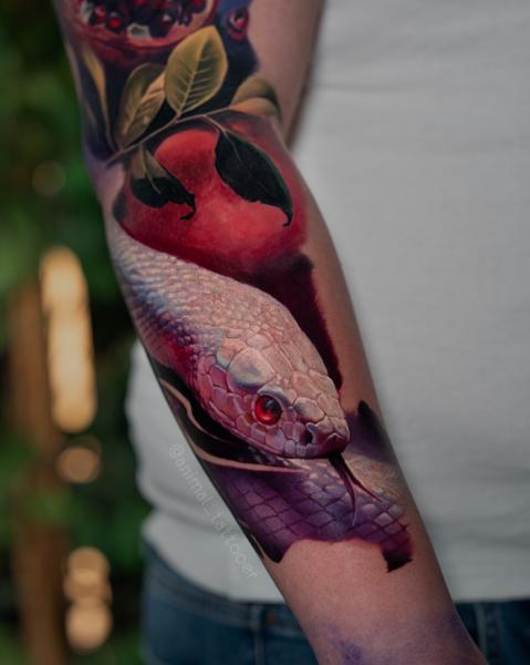 Realism snake and fruit tattoo by @animal_tattooer