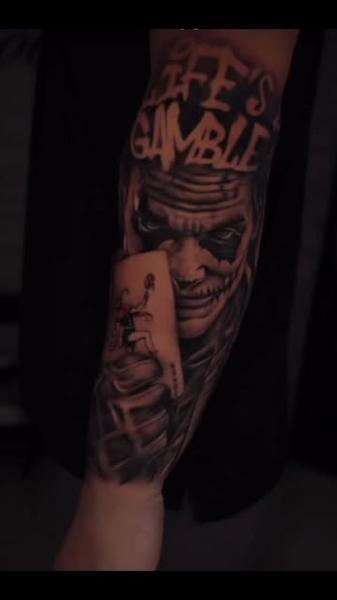 Realism joker card tattoo by @anna_tattooss