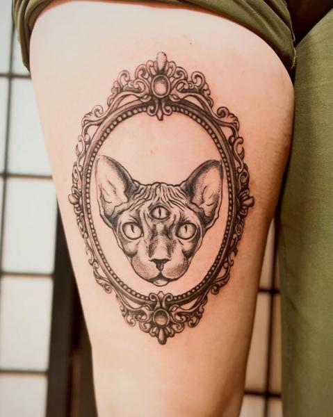 Illustrative three-eyed sphynx tattoo by @fresh.ink.anna