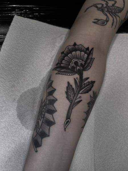 Traditional traditional flower tattoo by @antclaytattoo
