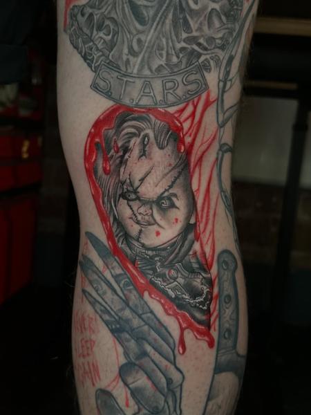 Realism chucky doll tattoo by @antclaytattoo