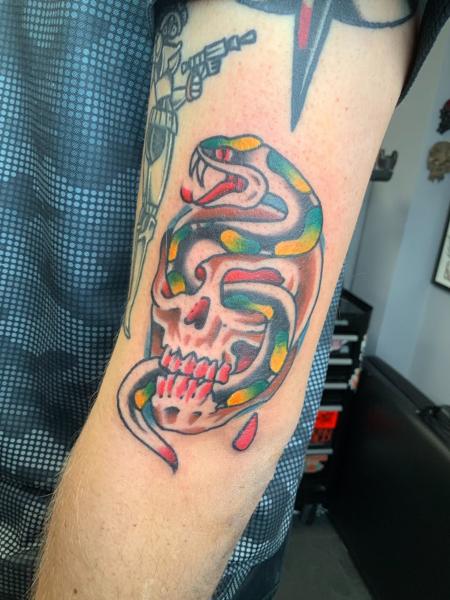 Traditional skull snake tattoo by @eagles_of_swindon