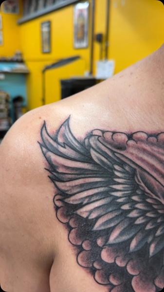 Black And Grey angel wing tattoo by @antisocialart