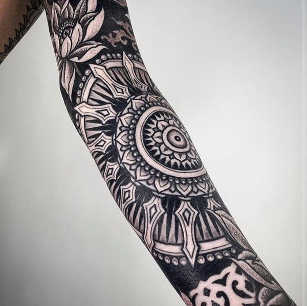 Blackwork mandala pattern tattoo by @ariesrhysing