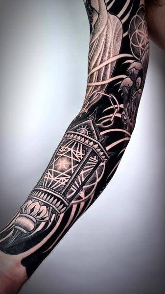 Blackwork geometric lantern tattoo by @ariesrhysing