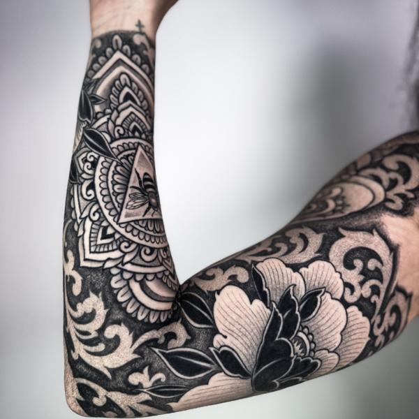 Blackwork mandala floral tattoo by @ariesrhysing