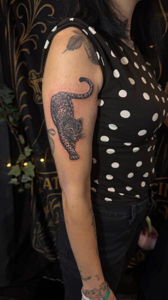 Realism leopard tattoo by @arkhanotattoo