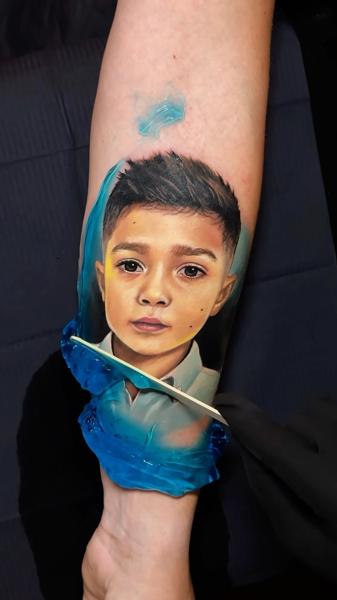 Realism child portrait tattoo by @artgambler