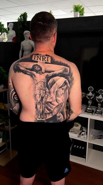 Realism crucifixion scene tattoo by @artgambler