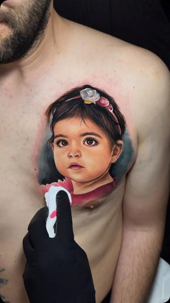 Realism child portrait tattoo by @artgambler