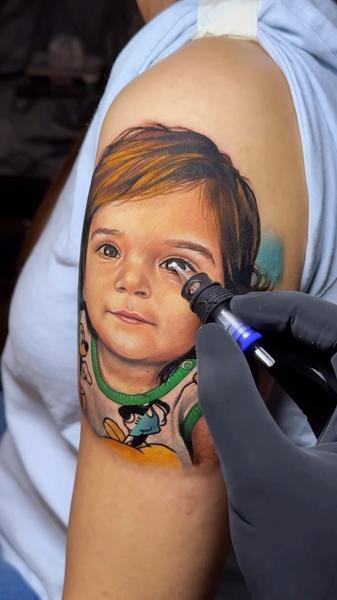 Realism child portrait tattoo by @artgambler