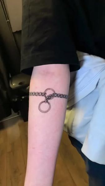 Fine line chain bracelet tattoo by @design4lifetattoo