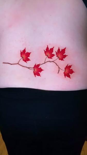 Realism maple leaves tattoo by @design4lifetattoo