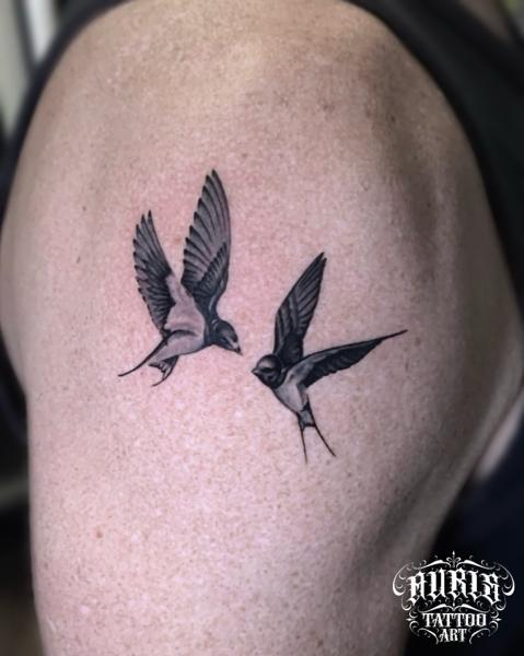 Realism flying swallows tattoo by @design4lifetattoo