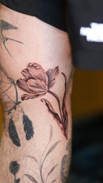 Realism floral design tattoo by @azramatitattoo