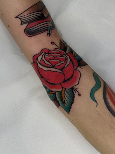 Traditional red rose tattoo by @batter_tattooer