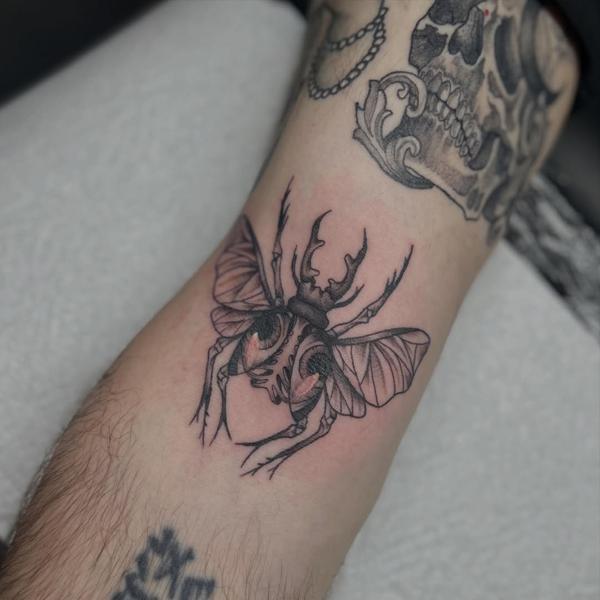 Linework beetle tattoo by @bec_tattoo