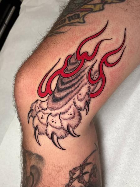Traditional flaming claw tattoo by @bemuti_tattoos