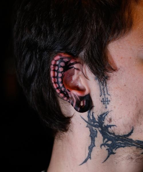 Blackwork abstract ear tattoo by @ben_h_tattoo