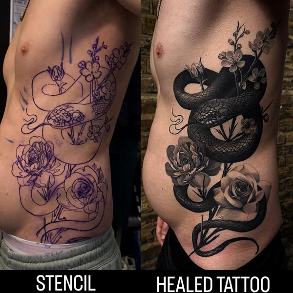 Realism floral snake tattoo by @bendunningtattoo