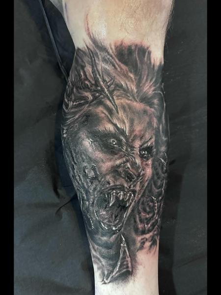 Realism demonic face tattoo by @benjaminmosstattoo