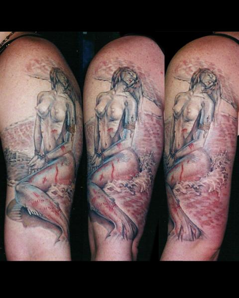 Realism mermaid tattoo by @benjaminmosstattoo