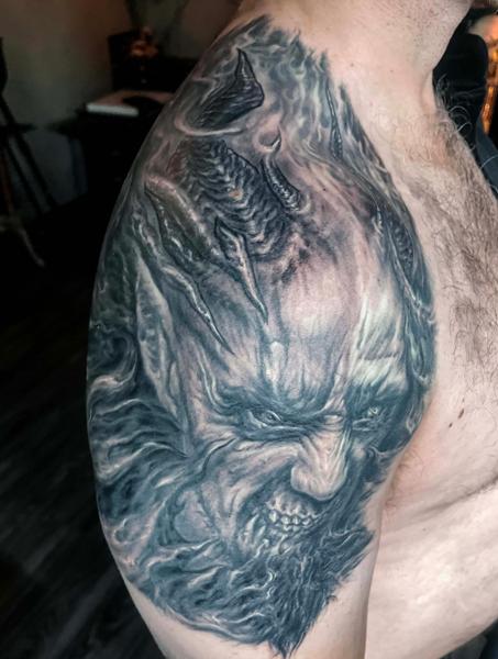 Realism demonic face tattoo by @benjaminmosstattoo