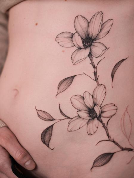 Fine Line floral branch tattoo by @betstattoo
