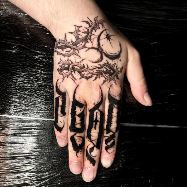 Blackwork thorny lettering tattoo by @skinnysinktattoo