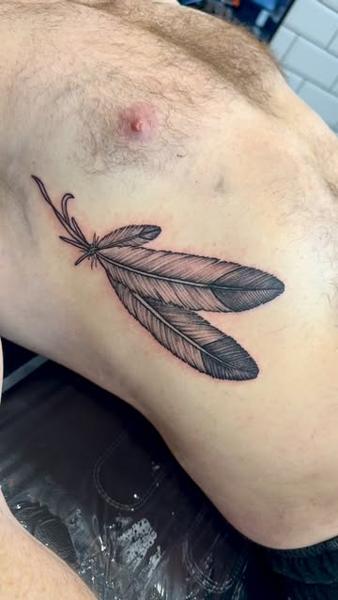 Fine line feather trio tattoo by @_blayn_