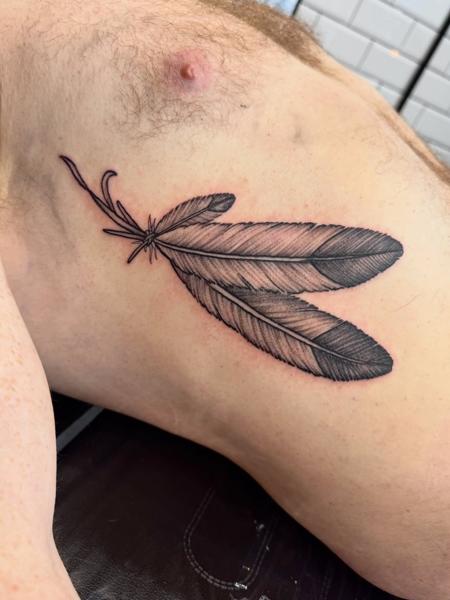 Fine line feather tattoo by @_blayn_