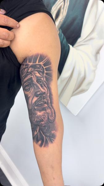 Realism jesus portrait tattoo by @bluedevilsink