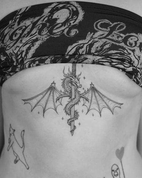 Blackwork winged dragon tattoo by @kwom.tattoos