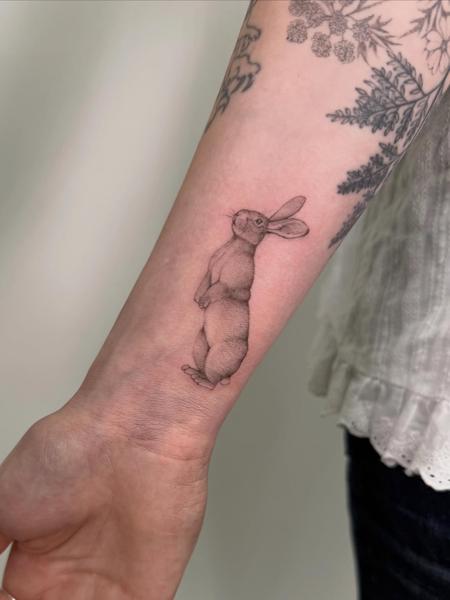 Fine line standing rabbit tattoo by @brittbeale