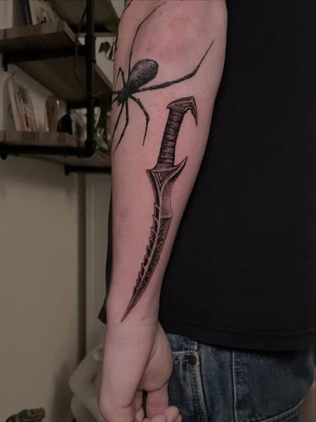 Realism spider and dagger tattoo by @dijon.did.it