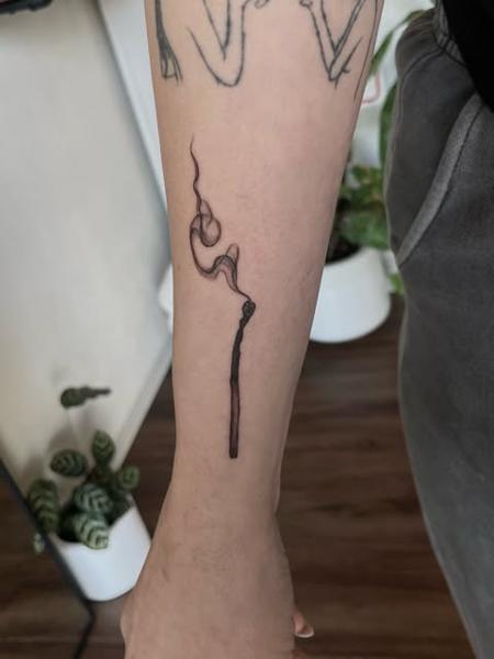Fine line burning matchstick tattoo by @dijon.did.it
