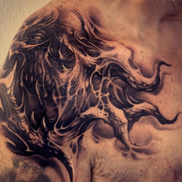 Blackwork abstract creature tattoo by @carlgracetattoos
