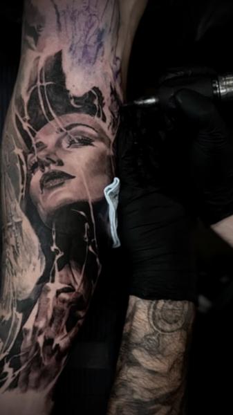 Realism female portrait tattoo by @carlostorresart