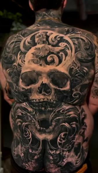 Realism ornate skull tattoo by @carlostorresart