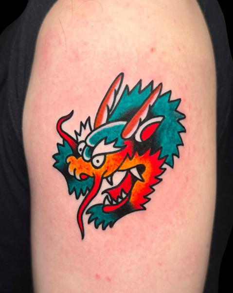 Traditional cartoon dragon tattoo by @carloszucato
